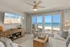 Unwind in your beachfront living room where panoramic ocean views meet coastal comfort through floortoceiling windows.