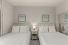 Bedroom 2 with 2 double beds.