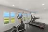 Your workout comes with stunning ocean views through floortoceiling windows in this bright fitness center.