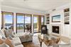 Living Area on 1st Floor with Fireplace and Private Balcony