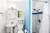 Full bathroom adjacent to the bedroom with queen bed.
