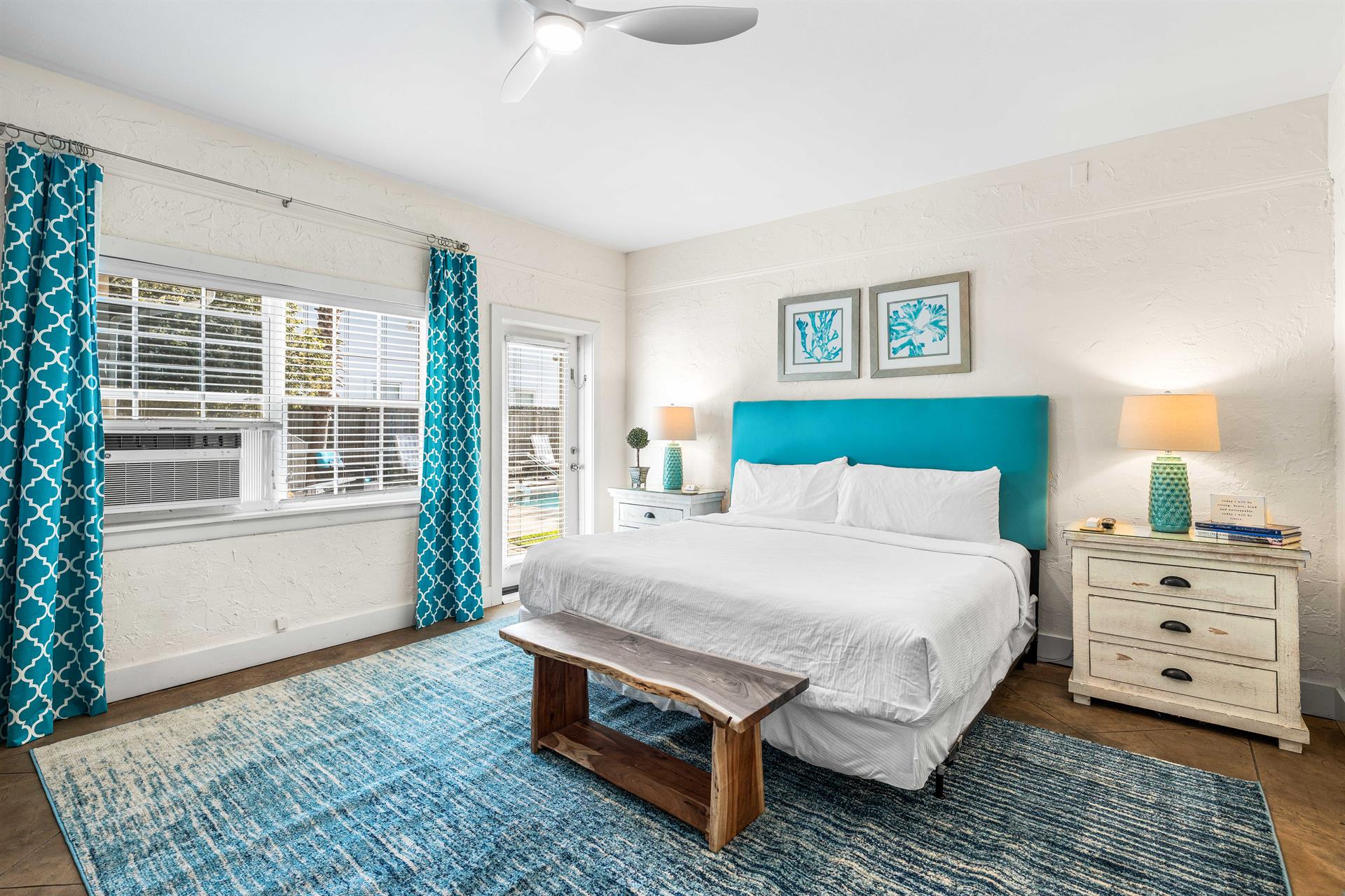 3rd Bedroom is the primary suite on the east end with a king bed, 45 TV,  walkin closet, ensuite full bathroom with a bathtubshower combination, and views of the pool area  door leading out to the
