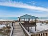Elevated beachside pavilion with stunning Gulf Coast views and pristine white sand stretching to turquoise waters.