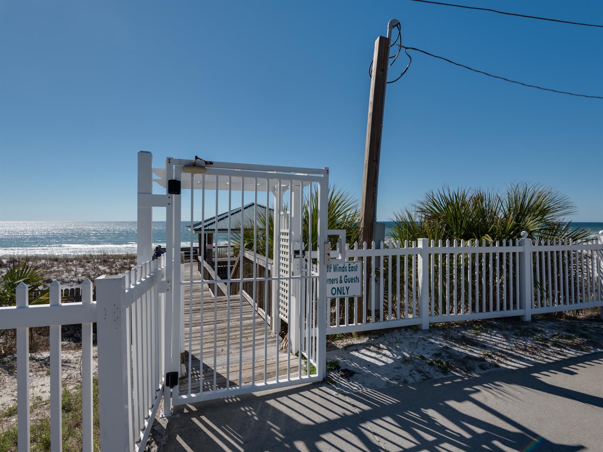 Private gated access leads directly to pristine beachfront, where crystalclear waters and sugarwhite sand await just steps from the property.
