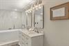 Step into your spalike bathroom with marble counters and a luxurious soaking tub.