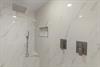 Step into your luxurious marble shower with rainfall head and handheld wand  perfect for unwinding after exploring.