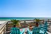 Relax in turquoise beach chairs on the private decks with stunning Gulf views