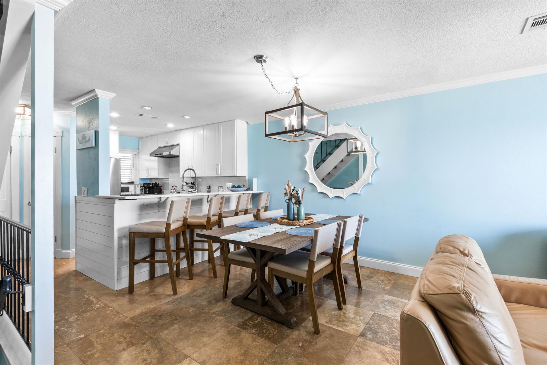 The openconcept living flows beautifully from the bright kitchen to elegant dining space.