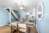 Savor memorable meals under elegant pendant lighting and open kitchen views.