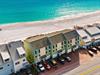 Stunning gulf front property sits steps from pristine turquoise waters and white sand beaches.
