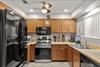The fully equipped kitchen features stainless steel appliances