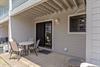 Back Patio located off of the kitchen featuring outdoor shower and furniture for dining al fresco