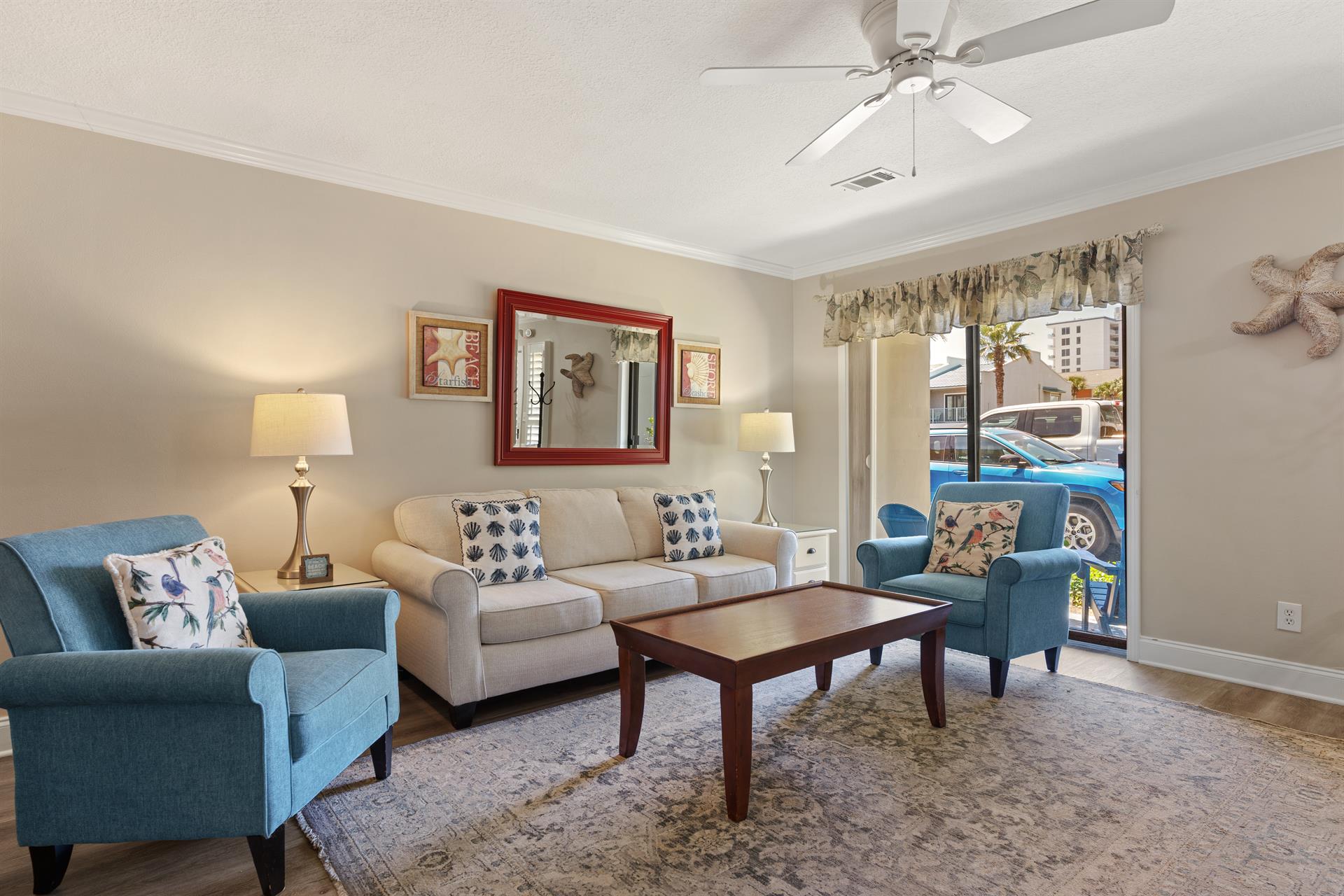 Living room opens to a patio