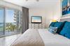Wake up to serene coastal views from your peaceful bedroom.