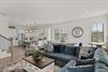 2nd Floor  Your spacious openconcept living area flows seamlessly from plush seating to a modern kitchen, with warm wood floors, abundant natural light, and a welcoming dining area—perfect for gathe