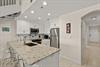 Your bright, modern kitchen features granite countertops, stainless steel appliances, and an open layout perfect for preparing meals and gathering with loved ones.