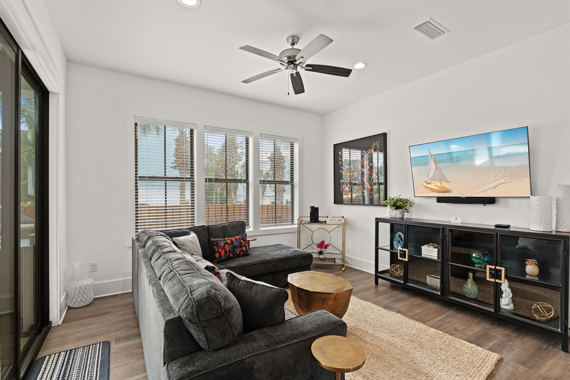 1st floor sitting area  Settle into plush seating near the pool and 1st floor bedroom. The bright, open layout invites you to relax and unwind in true comfort.