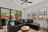 Settle into this inviting living space where natural light streams through expansive windows. Beyond the sliding doors, your private patio and pool await for seamless indooroutdoor living.