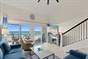Unwind in your oceanfront living space where panoramic views greet you through expansive glass doors. Relax on plush sofas or step onto the private balcony to feel the coastal breeze.