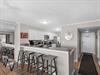 Step into your fully equipped kitchen with breakfast bar seating, granite countertops, and stainless steel appliances—ready for cooking and gathering with loved ones.