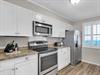 Natural light and modern touches make cooking a pleasure in this kitchen.
