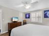 Bedroom 2complete with a ceiling fan, flat screen TV, and charming sea turtle artwork to make you feel right at home.