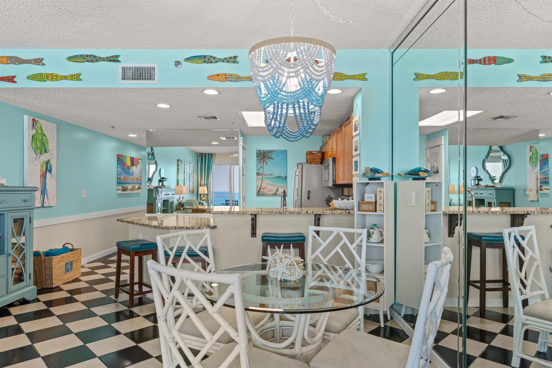 Dining area where playful fish murals surround your open kitchen and dining area.
