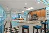 Fullyequipped kitchen featuring granite counters and stunning ocean views beyond.