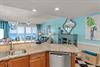 Vibrant coastal living with stunning Gulf views from your openconcept space