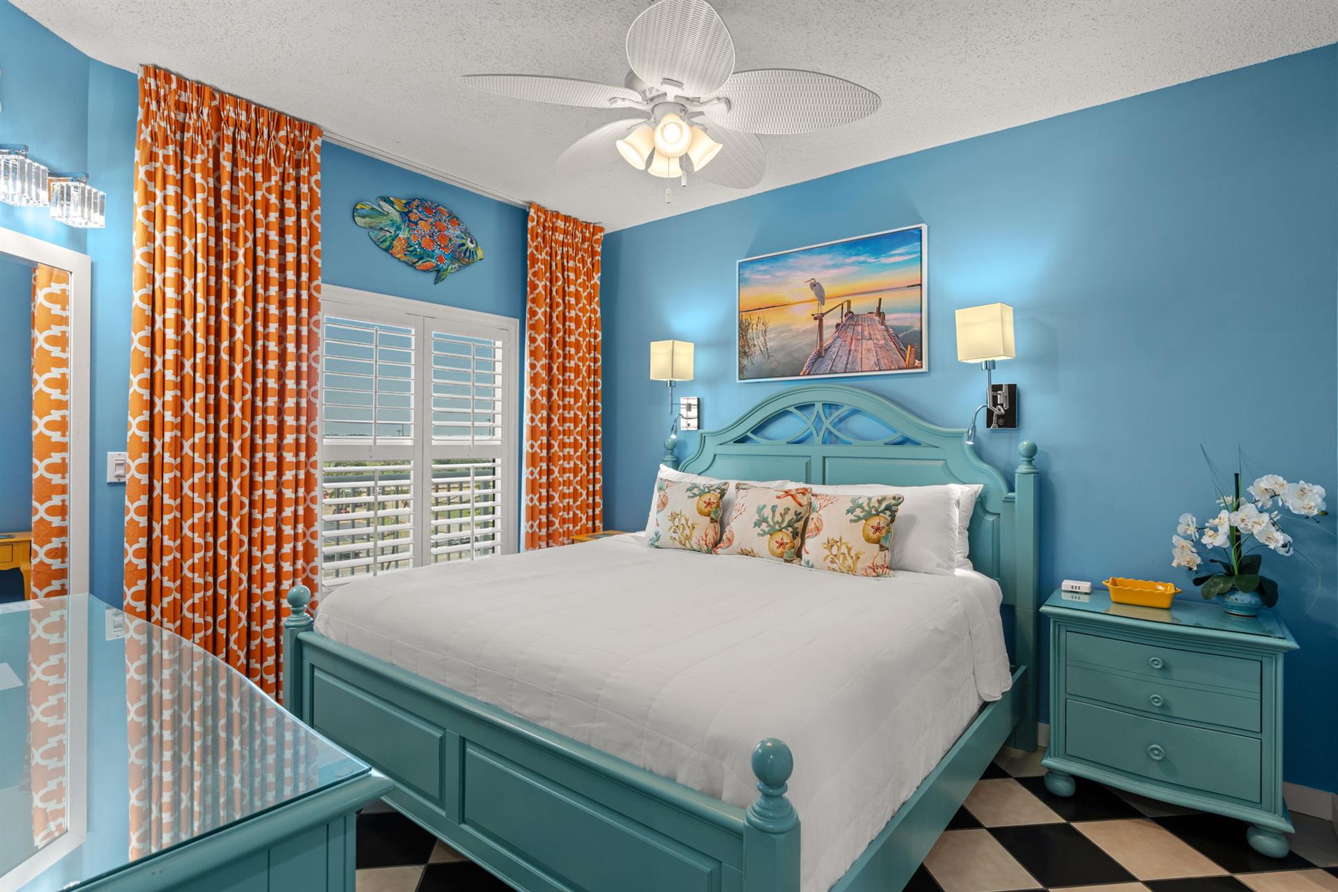 Sink into crisp white linens in this cheerful coastal Bedroom 1