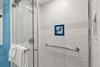 Bathroom 1 a rainfall shower head and grab rail