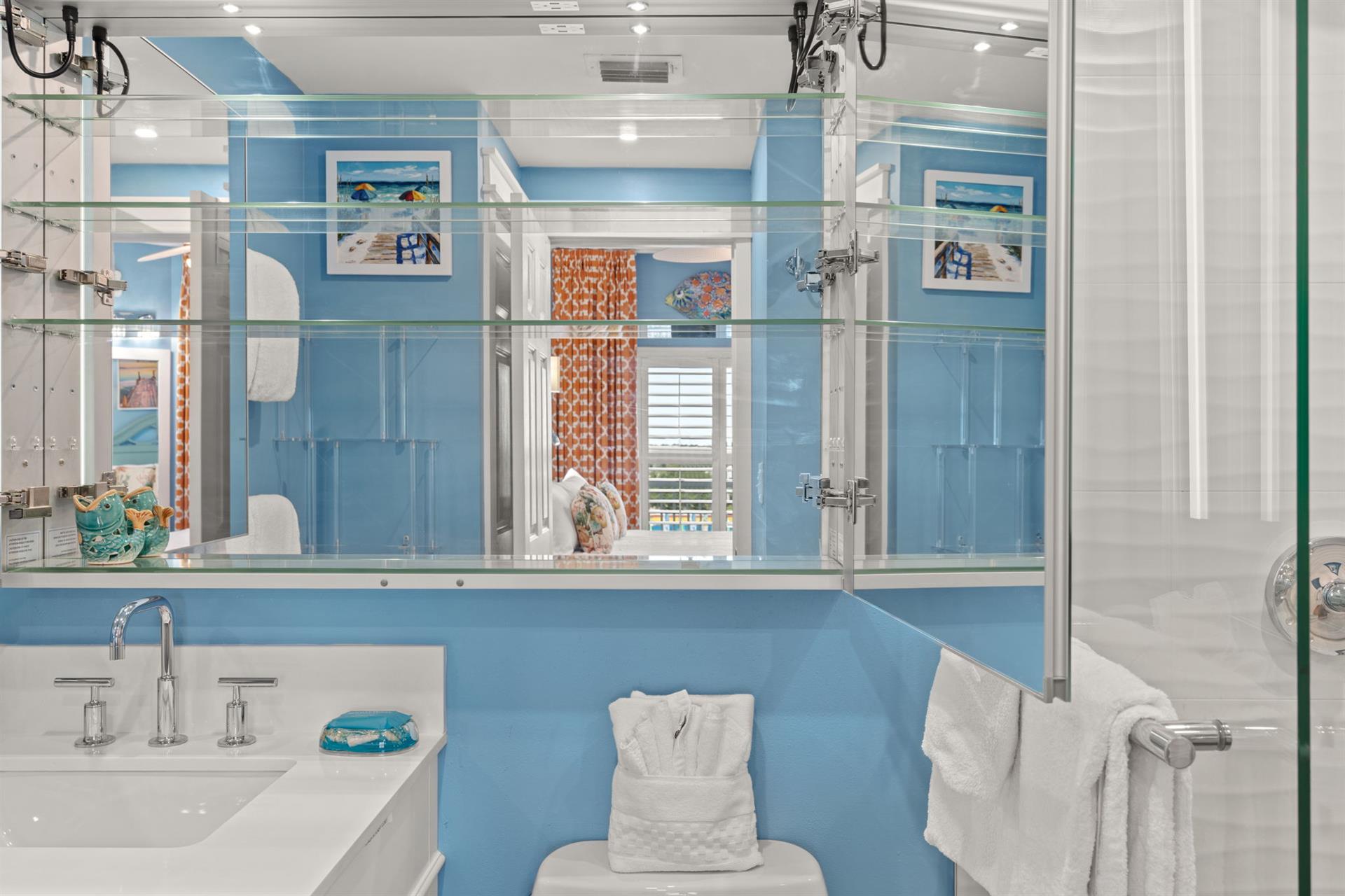 Bathroom 1 Vanity Opens to interior mirrors, allowing guests to see all angles