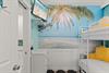 Bedroom 2 with Mounted TV and Beautiful Mural