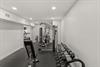Your private fitness suite awaits with premium equipment, from free weights to multistation machines, all in a clean, welllit space.