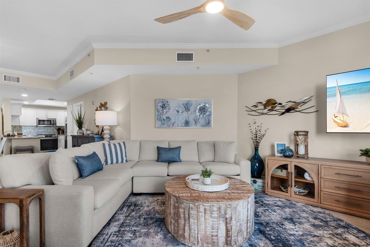 The welcoming living space features plush sectional seating and an open layout.