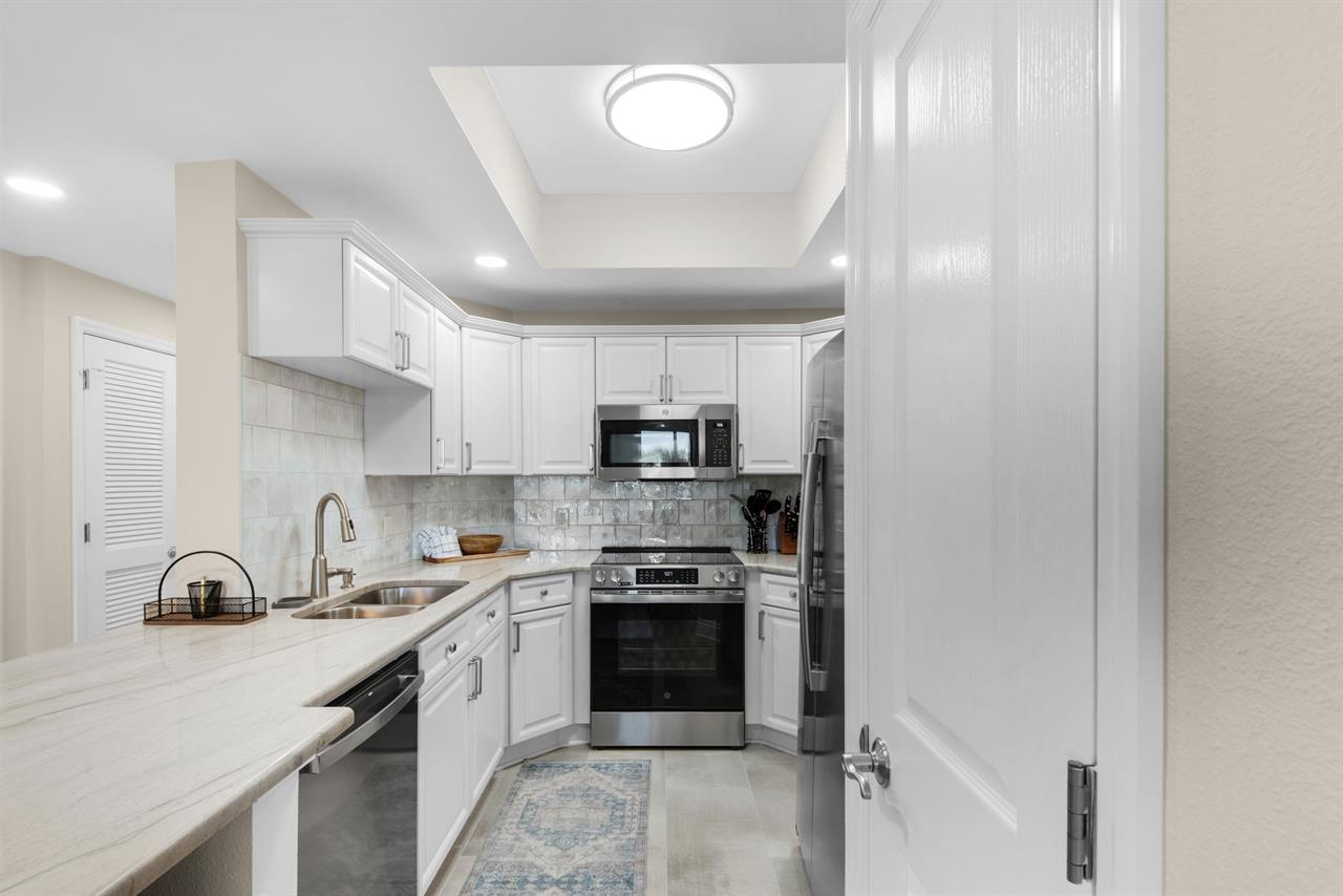 The gourmet kitchen sets the stage for delicious meals and cozy gatherings