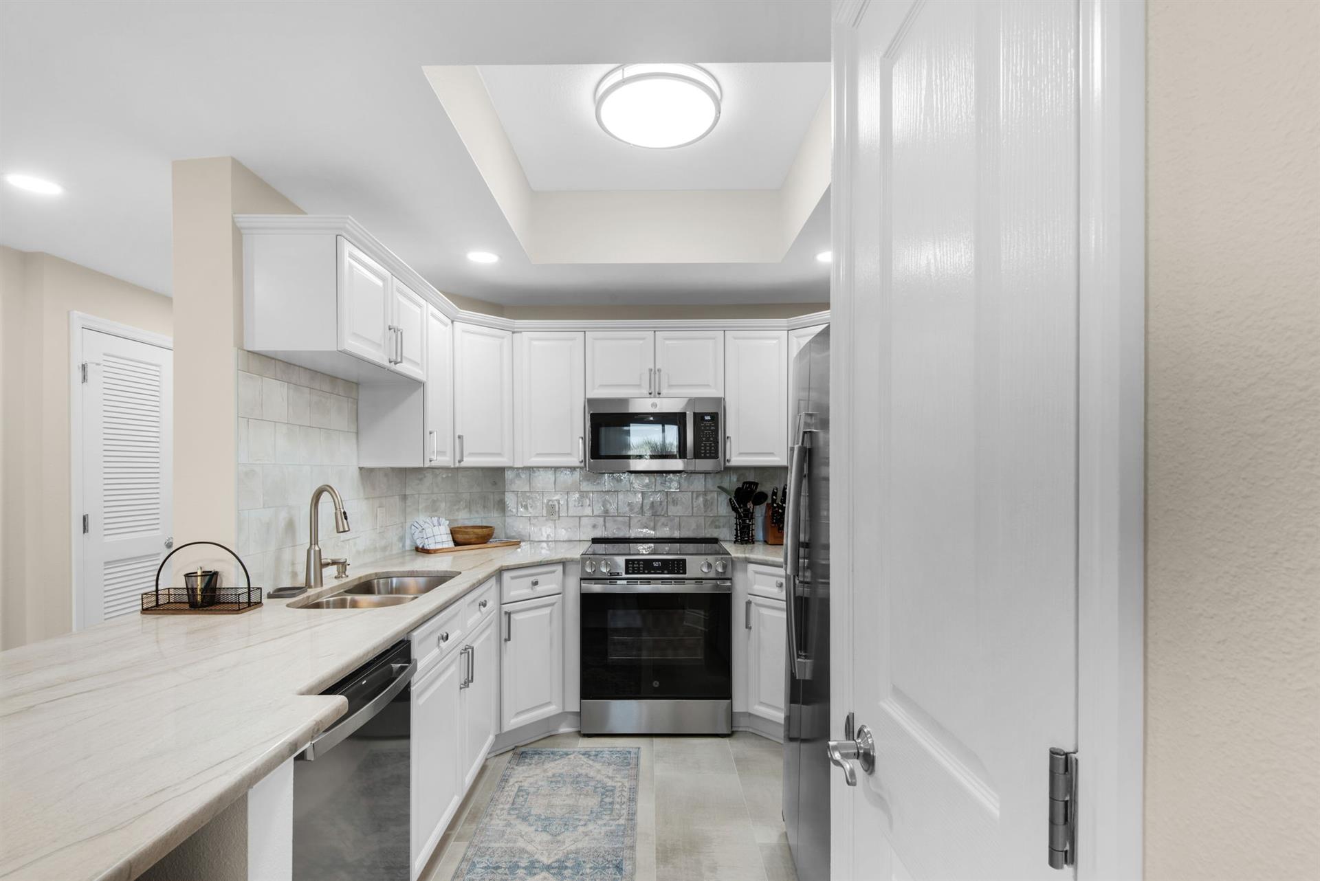 The gourmet kitchen sets the stage for delicious meals and cozy gatherings