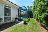 The Cove features a screenedin pool, lush tropical landscaping and a wellmaintained lawn
