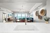 This bright, open living space invites you to unwind with stunning views stretching across the horizon from your balcony.