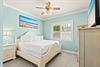 Unwind in this serene bedroom with its soothing coastalinspired palette promises restful nights and relaxing mornings.