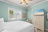 This peaceful retreat features calming coastal tones, a plush bed for restful nights, and beachinspired touches.