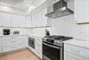 Step into the sleek, modern kitchen with stainless appliances, marblestyle backsplash, and all the tools to whip up memorable meals during your stay.