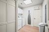 Laundry room with a fullsize washer and dryer makes packing light and staying fresh effortless during your stay.
