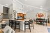 This openconcept kitchen and dining area are bright, spacious, and perfect for your group