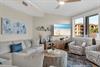 Sink into plush seating where coastal artwork sets a serene mood