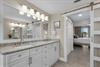 Step into the bright, spalike bathroom with dual sinks and sleek cabinetry