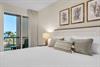 Wake up to ocean breezes and tropical views from the private balcony of the guest bedroom