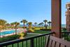 Soak in sweeping views of the sparkling pool, manicured lawns, swaying palms, and the shimmering ocean beyond from the comfort of your private balcony.
