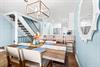 Savor memorable meals under elegant pendant lighting and open kitchen views.