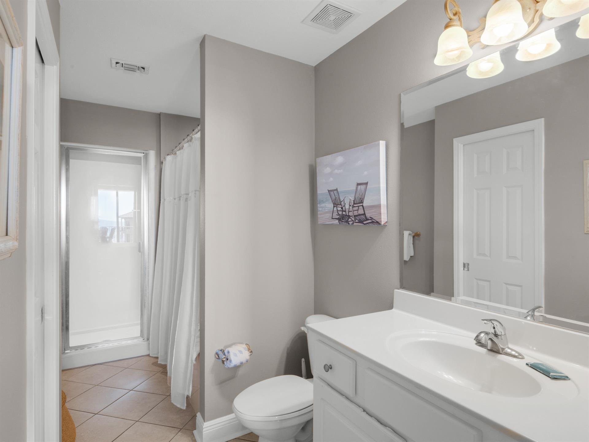 Your private bathroom features a refreshing shower, modern fixtures—everything you need for a comfortable, relaxing stay.
